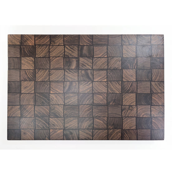 A rectangular wooden board or tray featuring a basket weave pattern of square wood blocks with varied dark brown and black grain textures, shown against a plain white background.